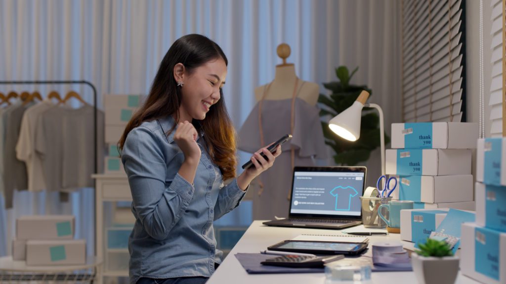 Entrepreneur checking at her mobile phone